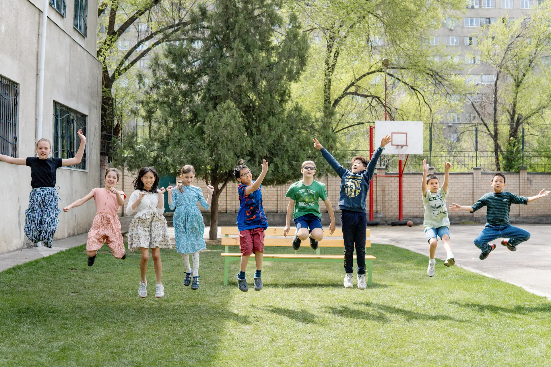 Fifth grade students jumping